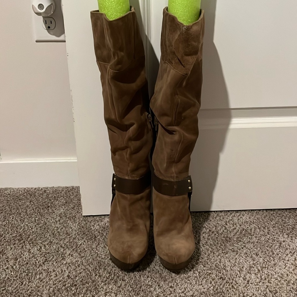 Double sole brown knee length boots with one gold buckle